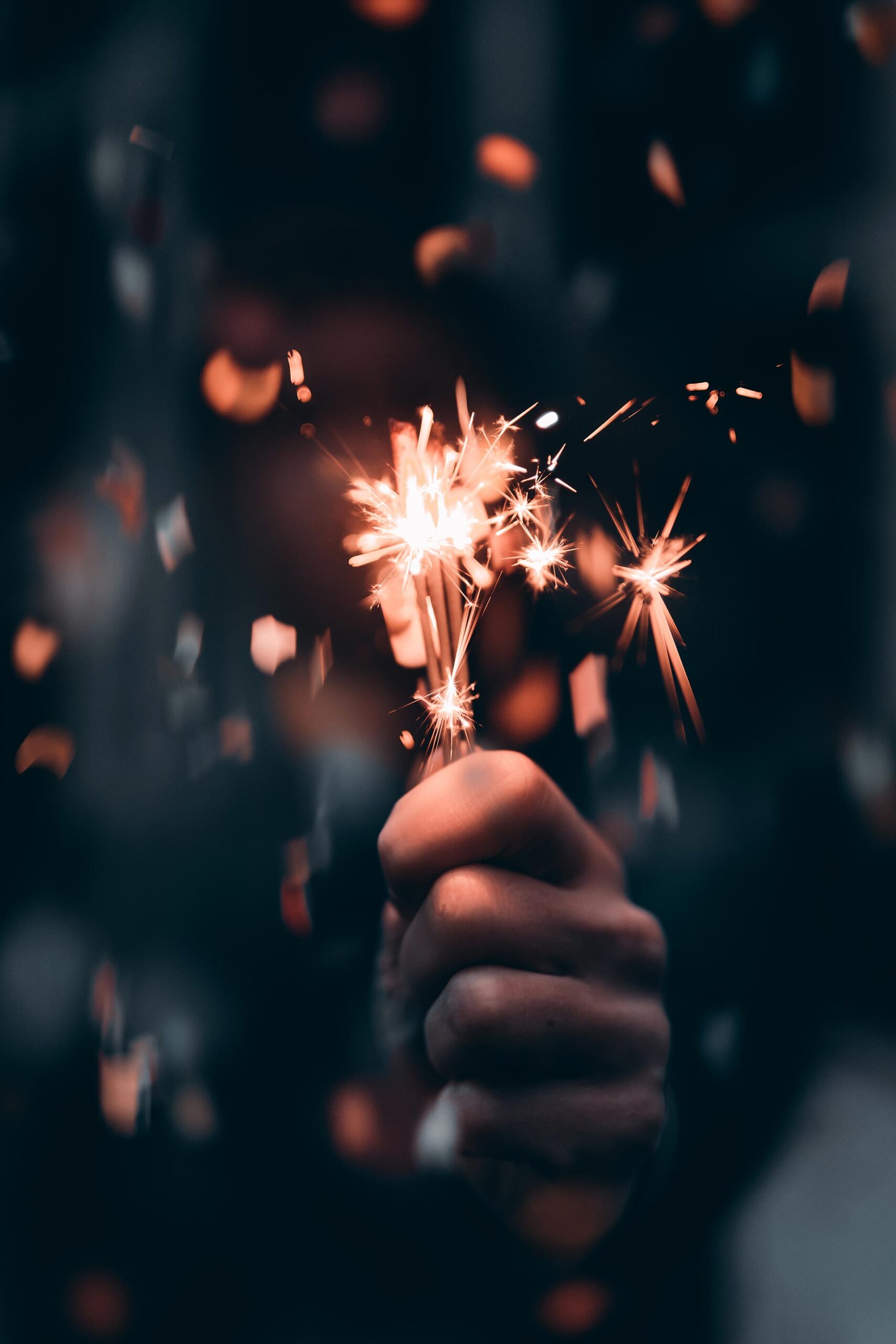 person holding a sparkler in macro photography 3264533 scaled 2