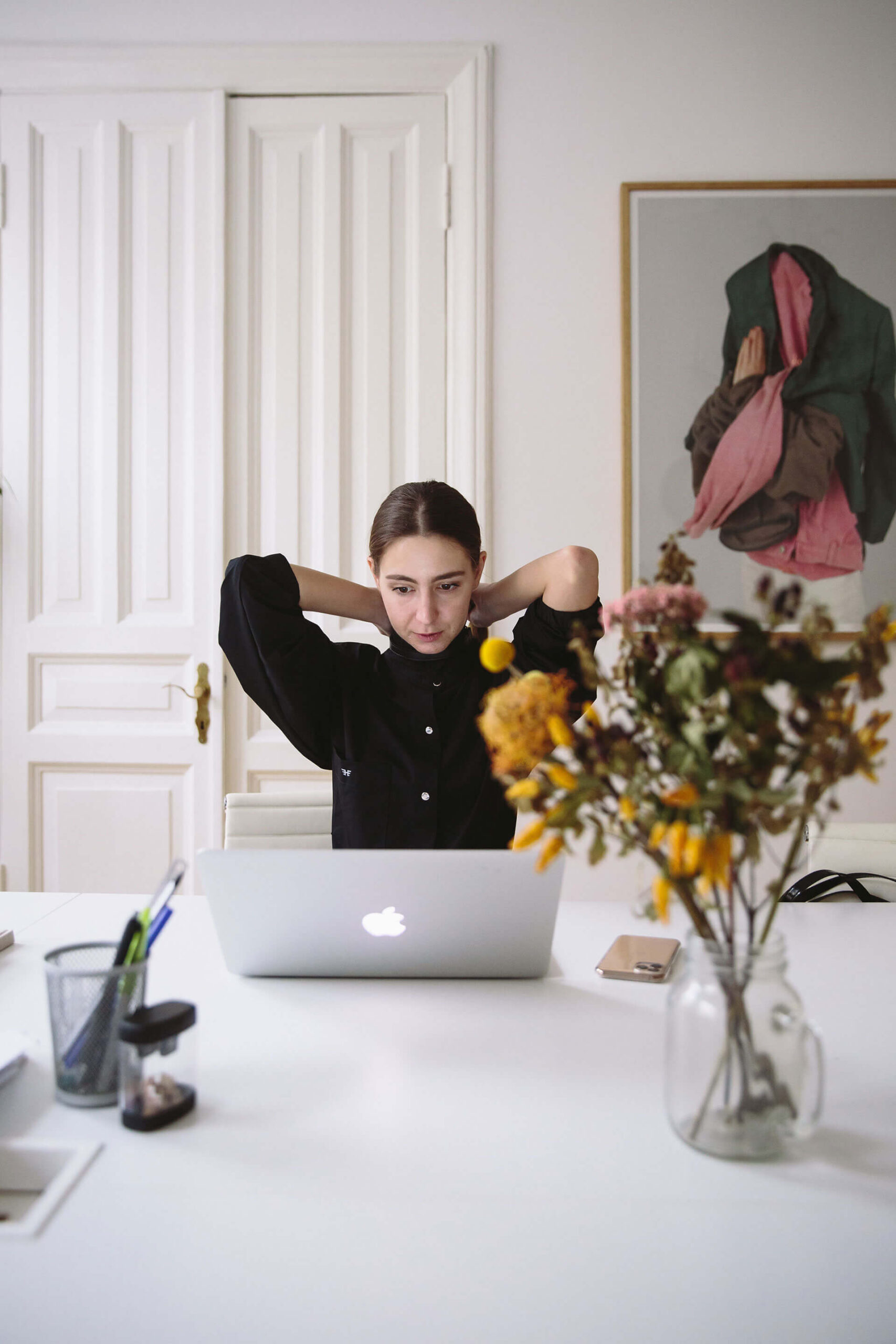 woman in black blouse sitting in front of silver laptop 3747432 1 scaled 2