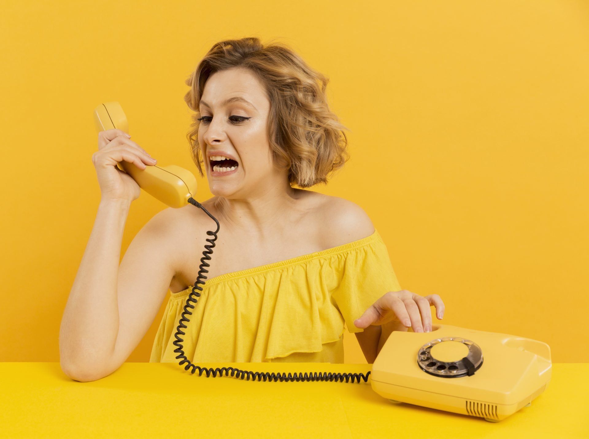 woman nervous screaming old phone conversation e1611046900640